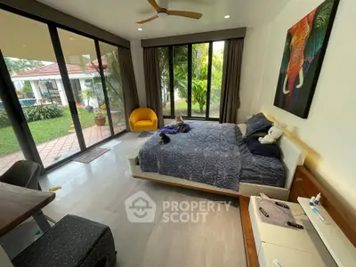 Spacious bedroom with garden view and modern decor