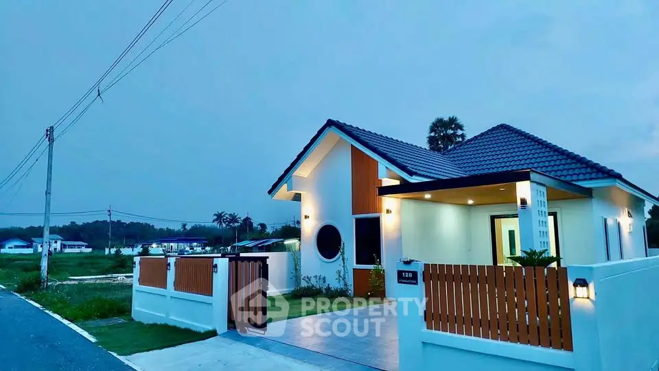 Charming modern house with stylish exterior and inviting entrance at dusk.