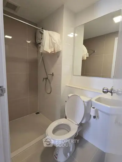 Modern bathroom with shower and toilet in sleek design