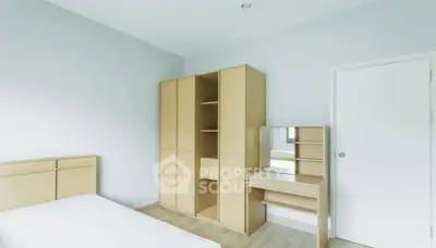 Minimalist bedroom with wooden furniture and natural light