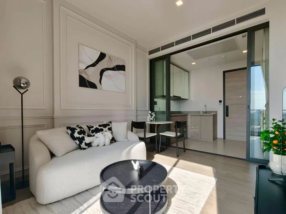 Modern living room with open kitchen and stylish decor