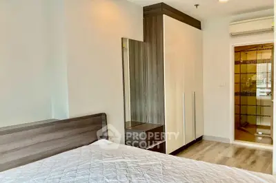 Modern bedroom with ensuite bathroom and sleek wardrobe design