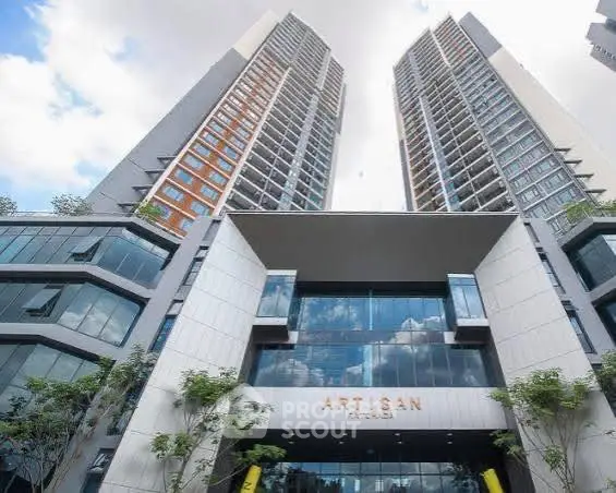 Stunning modern high-rise building with sleek architecture and expansive glass facade in prime urban location.