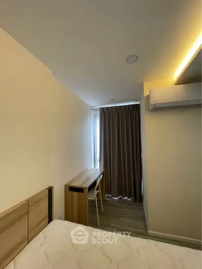 Cozy bedroom with modern furnishings and natural light