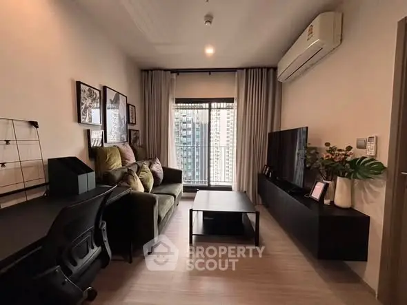 Modern living room with stylish decor and city view, featuring a cozy sofa and sleek entertainment unit.