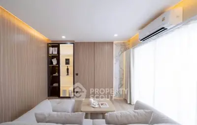Modern living room with elegant lighting and cozy seating area