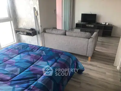 Modern studio apartment with stylish decor and cozy living area, perfect for urban living.