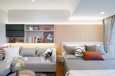 Modern bedroom with stylish decor and cozy seating area