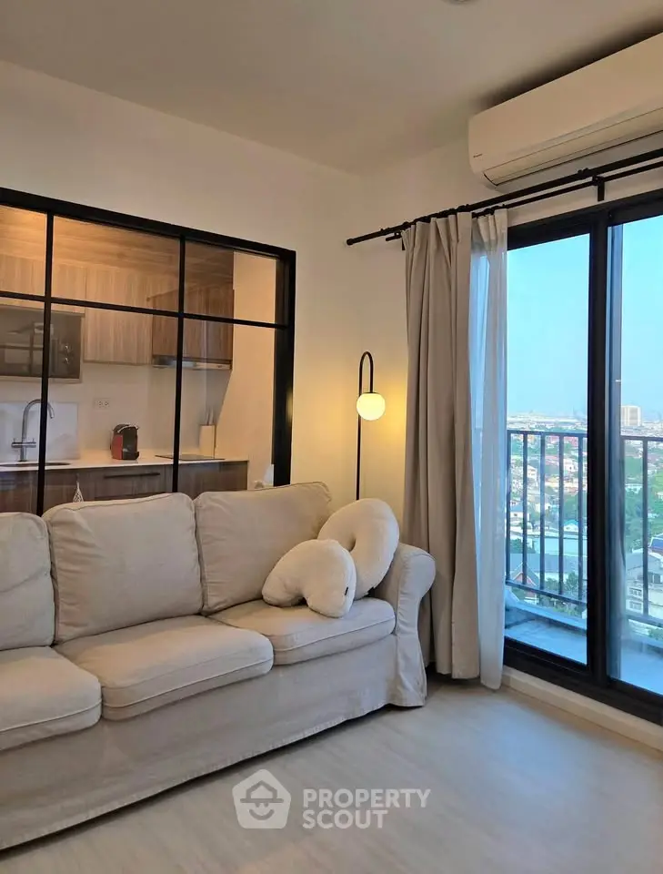 Modern living room with cozy sofa and city view balcony in stylish apartment