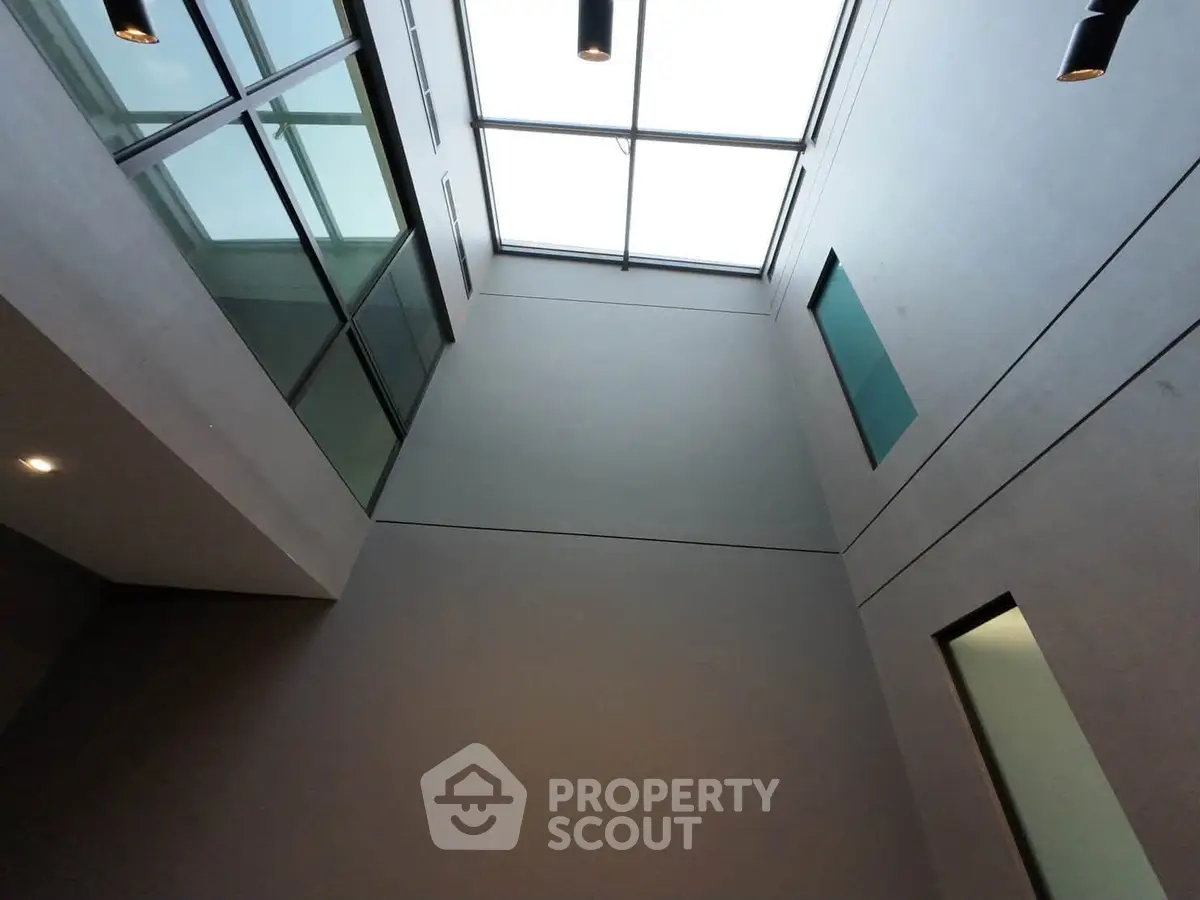 Modern building interior with skylight and glass panels