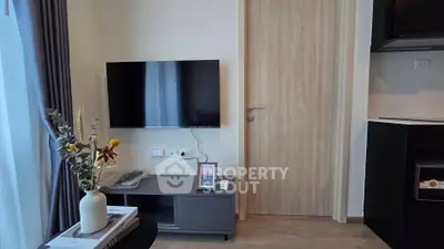 Modern living room with wall-mounted TV and stylish decor