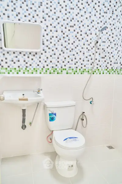 Modern bathroom with stylish mosaic tiles and sleek fixtures