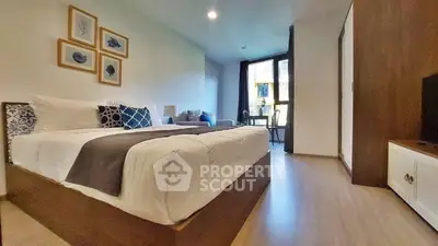 Spacious modern bedroom with stylish decor and natural light
