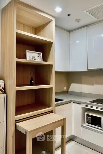 Modern kitchen with sleek cabinetry and built-in appliances