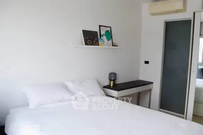 Modern bedroom with minimalist decor and air conditioning unit