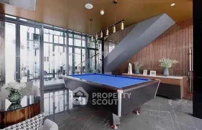 Luxurious modern living room with pool table and stylish decor