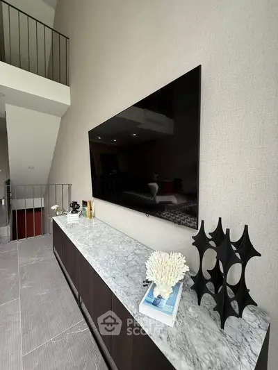 Modern living room with sleek TV setup and stylish decor