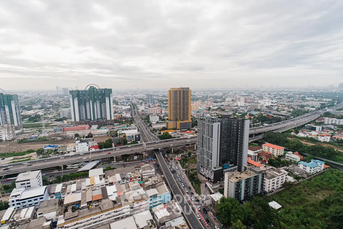 Stunning aerial view of urban skyline with modern high-rise buildings and bustling cityscape.