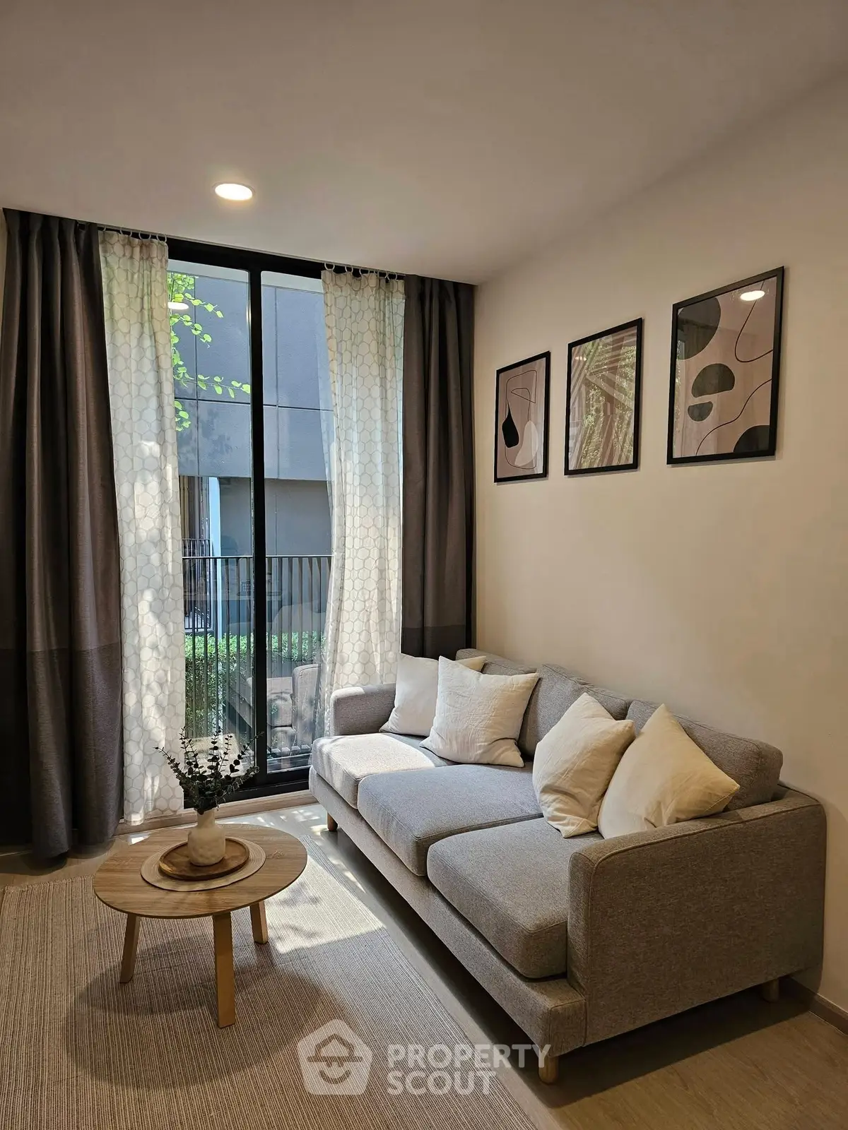 Cozy living room with modern decor and large window view