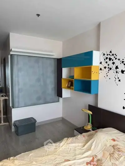 Modern bedroom with colorful shelving and stylish decor