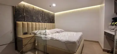 Luxurious bedroom with modern design and elegant lighting in a stylish apartment.