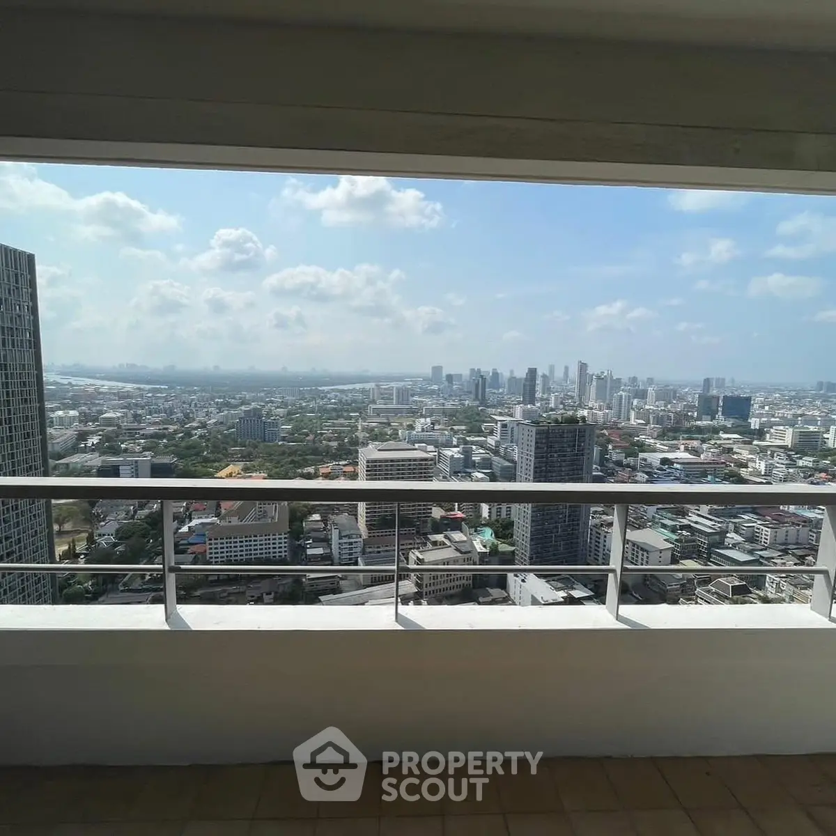 Stunning cityscape view from a high-rise balcony, perfect for urban living enthusiasts.