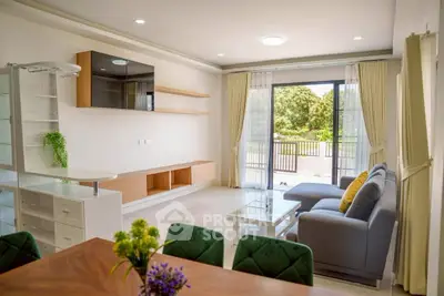 Spacious modern living room with large windows and stylish furniture