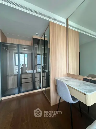 Modern bedroom with elegant wooden wardrobe and stylish vanity area