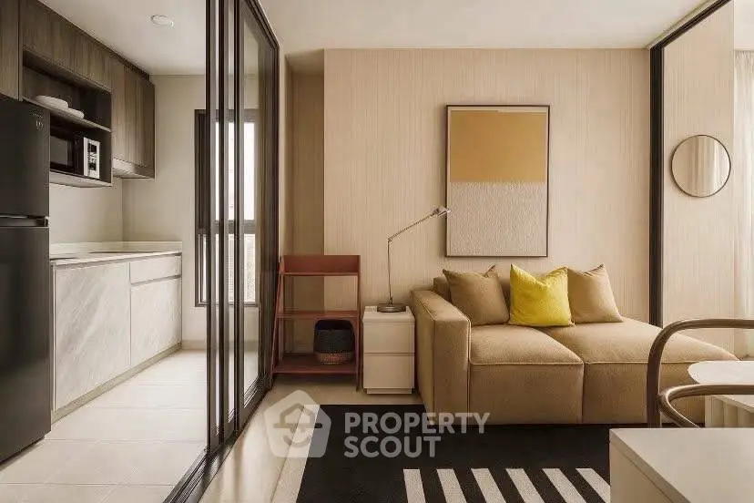 Modern living room with cozy sofa and open kitchen layout, perfect for urban living.