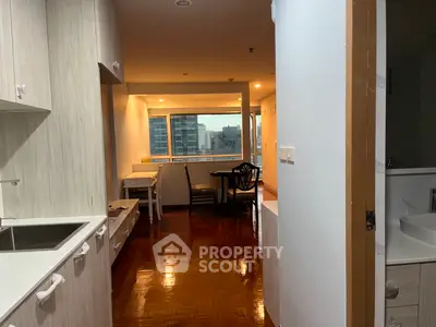 Spacious open-layout kitchen and dining area with city view, perfect for modern living.