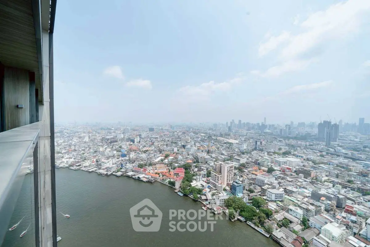 Stunning high-rise cityscape view overlooking a river and urban skyline, perfect for city living enthusiasts.