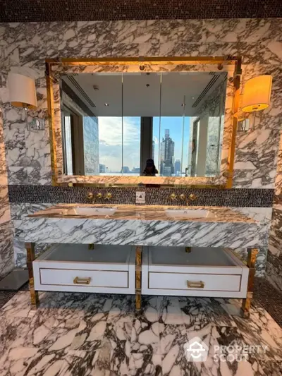 Luxurious marble bathroom with dual sinks and city view