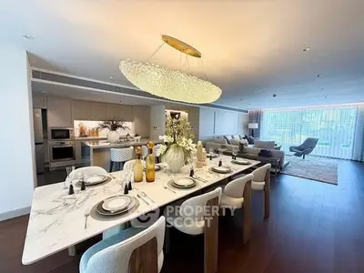 Luxurious open-plan living room with elegant dining area and modern kitchen.