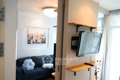 Modern living room with wall-mounted TV and stylish decor