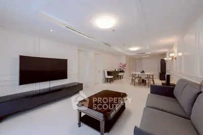 Spacious modern living room with elegant decor and large TV