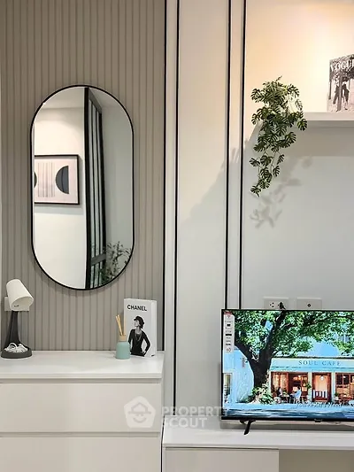 Modern living room with stylish decor and wall-mounted TV