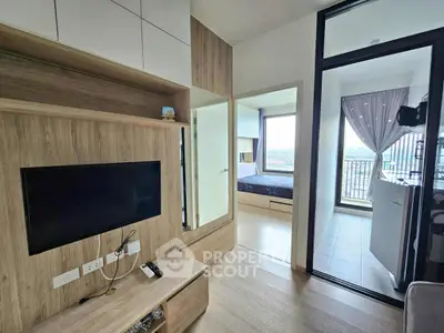 Modern apartment interior with living room, bedroom, and balcony view.