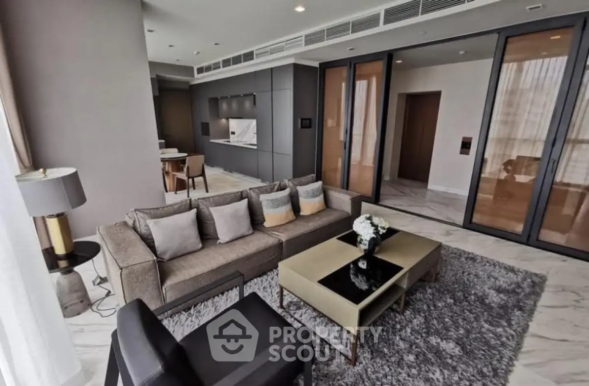 Luxurious modern living room with open kitchen and elegant decor