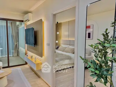 Modern apartment interior with cozy living room and stylish bedroom, featuring elegant decor and natural lighting.