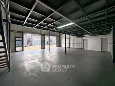 Spacious industrial warehouse with open layout and high ceilings