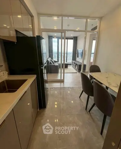 Modern open-layout kitchen and living room with city view