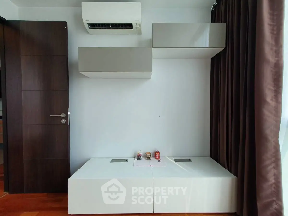 Modern minimalist interior with sleek storage and air conditioning