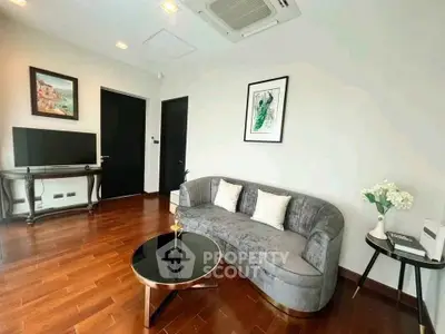 Elegant living room with modern decor and hardwood floors