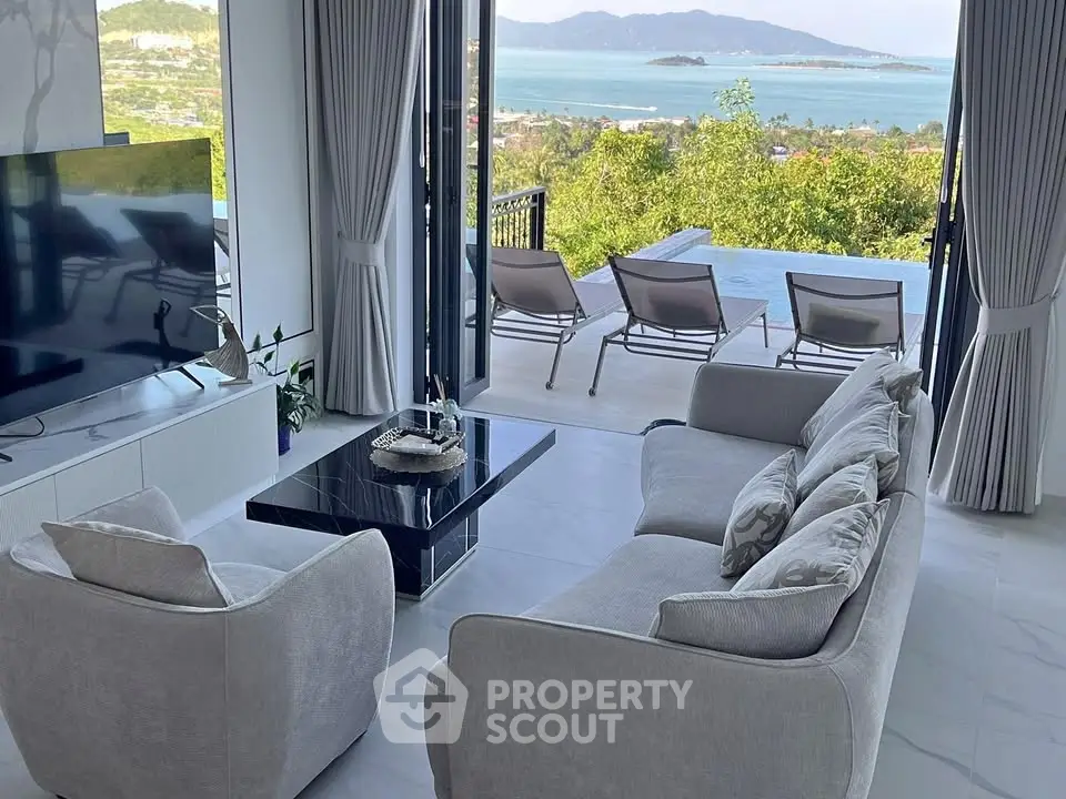 Luxurious living room with stunning ocean view and infinity pool access