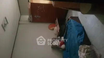 Cozy bedroom with simple furnishings and plush toys, ideal for a child's room.