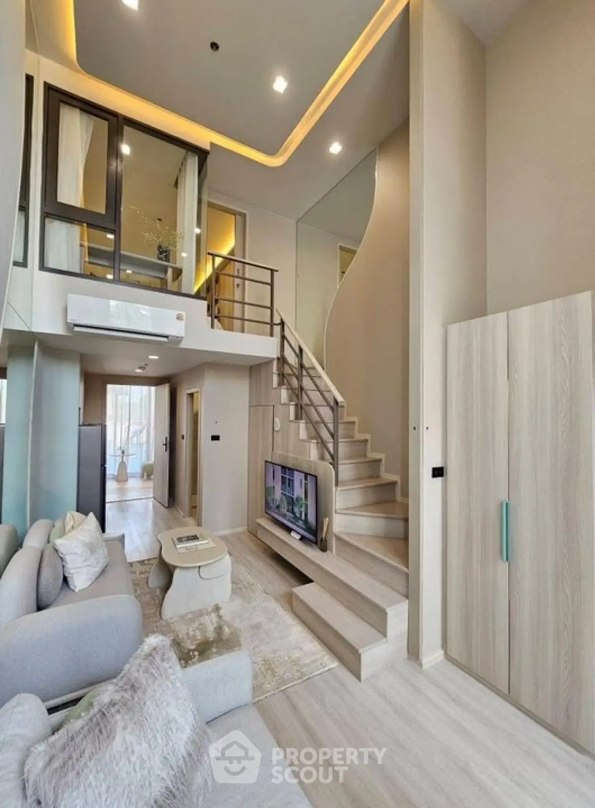 Modern duplex living room with high ceilings and stylish decor