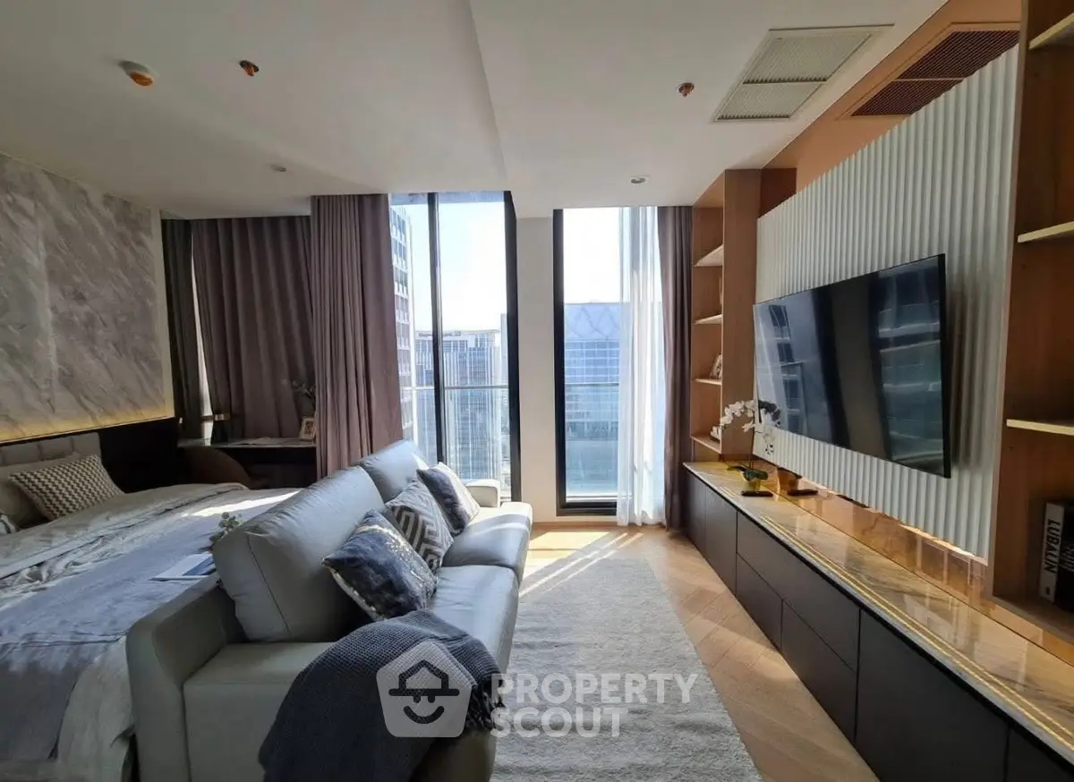 Luxurious modern living room with large windows and city view