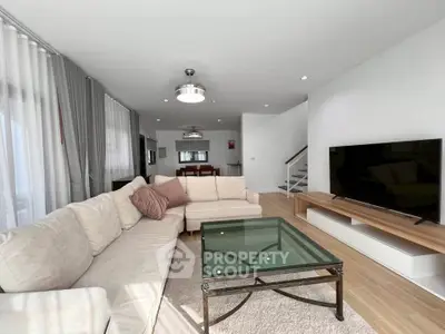 Spacious modern living room with elegant decor and large sectional sofa