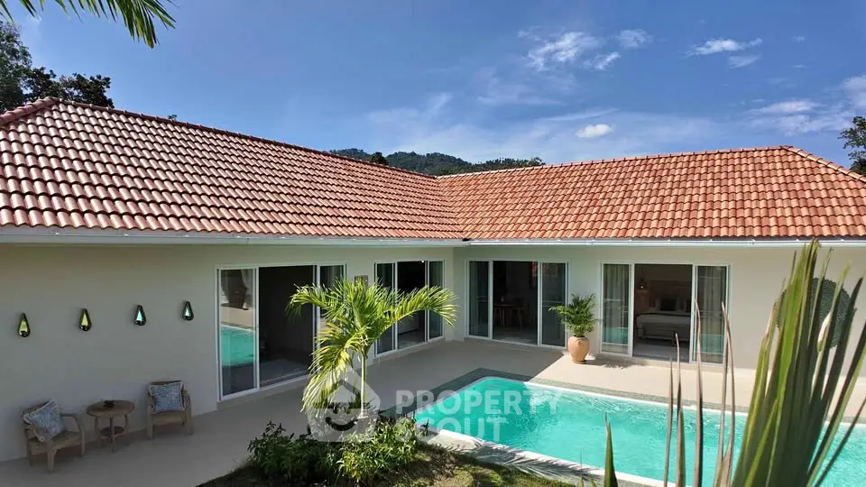 Stunning villa with private pool and lush garden, perfect for luxury living in a tropical paradise.