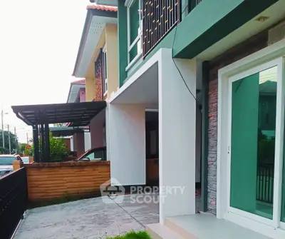 Modern townhouse exterior with sleek design and spacious driveway